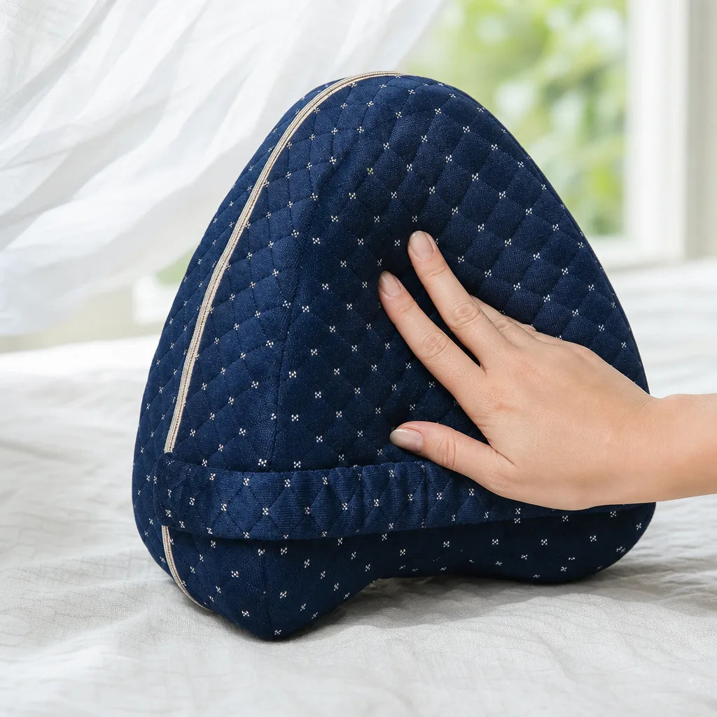 Close detail of the breathable navy quilted pillow holding its shape