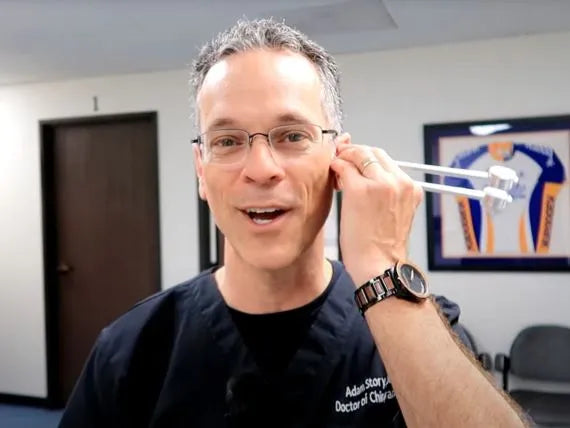 Person using a 128 Hz tuning fork
